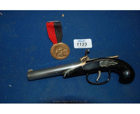 A pistol cigarette Lighter and Portuguese commemorative Medal - Prince Henry Navigator.