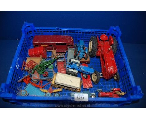 A quantity of farm Toys including two Ford tractors, Land rovers, discs, plough, muck spreader, horse box, hay trailers and a