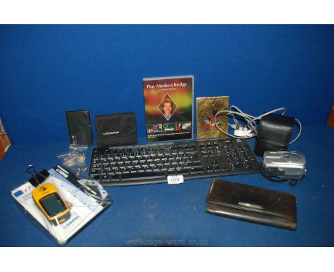 A Garmin ''Walkers'' GPS and software, a Fujifilm Digital Camera and leads, purses, etc.