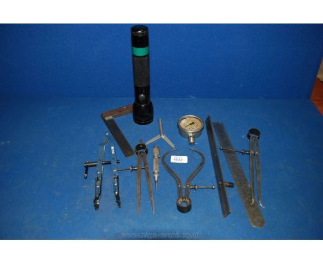 A box of engineering Tools including three steel sets of dividers, spring centre Punch, two rulers, two squares, an oil bar P