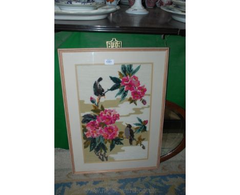 A framed Tapestry of birds on branches of Rhododendrons.