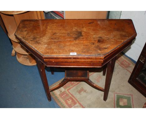 A late 19th c. Walnut fold-over swivel top Card Table, being of octagonal shape when open, with green baize gaming surface, o