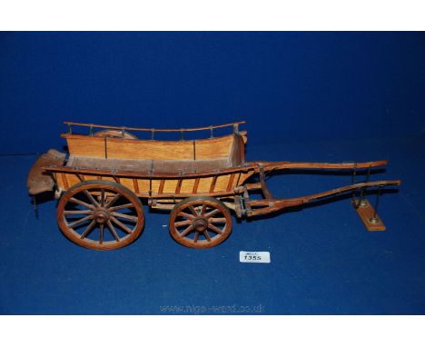 A fully functioning scale Model of a four wheeled Hay Wain farm Cart, with pivoting front wheels and sloping side panels, for