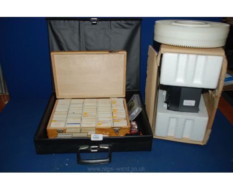 A wooden box containing 35mm slides, three boxes of slides, Sasco Slide Projector, instrument tuner, toy cars, etc.