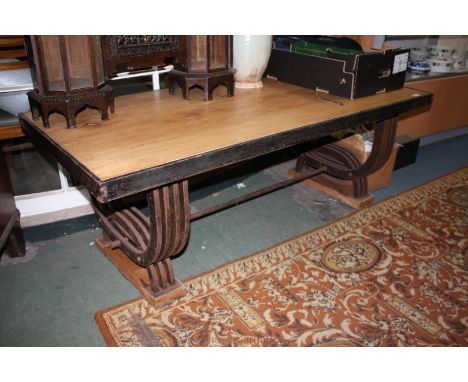 A bespoke forge made Lounge Table having solid rectangular Walnut top in steel surround on stylised hooped steel legs with tu