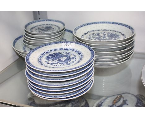 A quantity of blue and white oriental dragon decorated Plates, Bowls and Saucers, four character mark to base