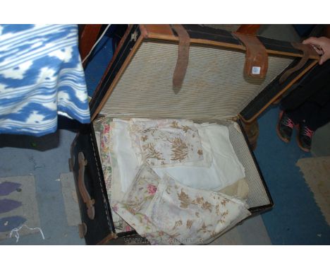A canvas and leather bound Trunk and contents including material, etc.
