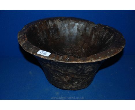 A primitive mixing Bowl of 16" diameter carved from a solid section of tree trunk.