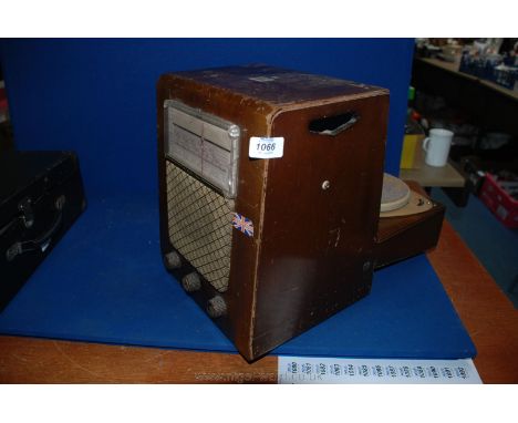 An early "His Masters Voice" upright rear fold-out mains powered Record Player, Beech and ply cased with Bakelite release but