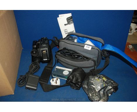 A JVC compact VHS Videomovie GR-AX5 VHS-C Video Camera in case with various accessories.