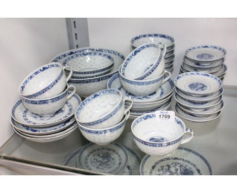 A range of blue and white oriental dragon decorated Saucers, Bowls and Teacups, four character marks to base