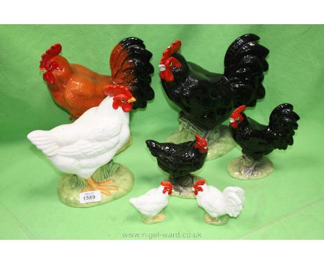 Six assorted ceramic chickens.
