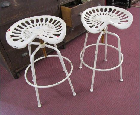 Pair of vintage tractor seat adjustable stools