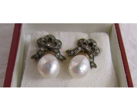 Pair of bow topped diamond &amp; pearl earrings