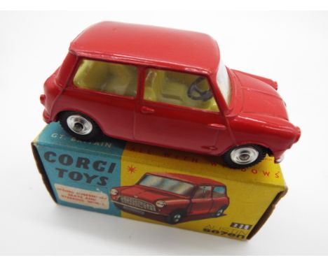 Corgi - a diecast model Austin Seven Mini, red body and chassis, cream interior, steering wheel, spring suspension # 225, app