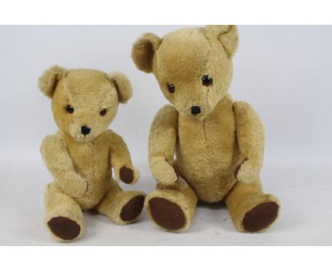 Two Deans Teddy Bears, 1950s comprising one with operational growler, stuffed golden mohair body, orange and black glass eyes