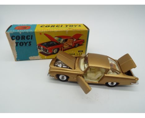 Corgi - a diecast model Ghia L.6.4, the hood opening to reveal Chrysler engine, and with opening doors and boot, dog on rear 