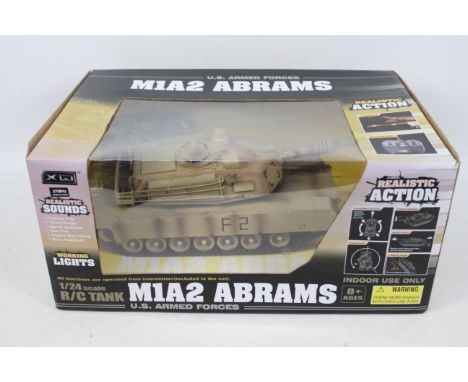 Modelzone - A boxed remote control U.S. M1A2 Abrams tank in 1/24 scale # 0678. The model appears Mint in a Good box with ligh