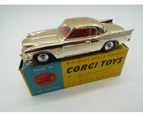 Corgi - a diecast model Studebaker 'Golden Hawk' metallic gold body, red interior, grey chassis, steering wheel, spring suspe