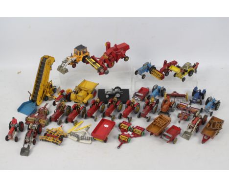 Dinky Toys - Corgi Toys - An unboxed grouping of 30 diecast agricultural vehicles and implements. Lot includes Dinky Toys 27a