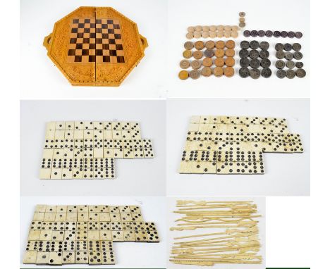 A set of bone and ebony dominoes, a similar boxed set, a set by St George Series, a mixed bag of wooden draughts, two 19th ce