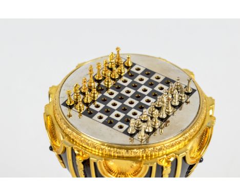 A 20th century Franklin Mint "Imperial Jewelled Egg" for the House of Fabergé, containing miniature chess set (31 piece) and 
