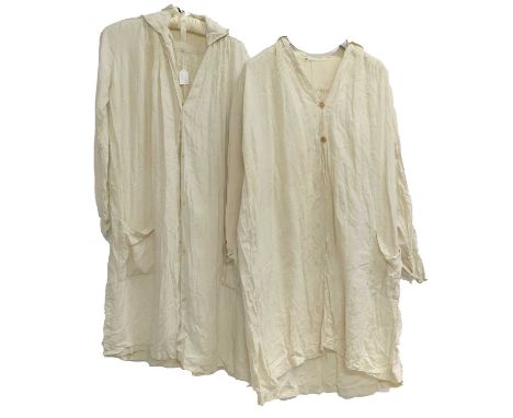 Two Early 20th Century Linen Farmers Smocks, one with hand smocking to the bodice and back, embroidery to the patch pockets, 