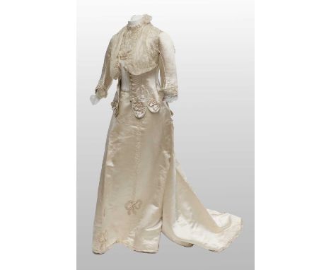 19th Century Costume, comprising a cream silk tailored jacket with elbow length sleeves, piped and weighted scalloped hem, bu