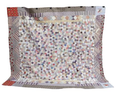 19th Century Patchwork Quilt, comprising a centre of hexagonal patches in purple, pink, blue, brown patterned cottons, within