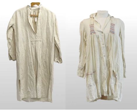 A Late 19th Century Cream Linen Farmers Smock with red and blue hand smocking to the bodice and back, red embroidery to the p