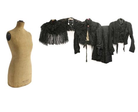 19th Century Costume comprising black silk brocade two piece comprising a pleated full skirt with floral appliqués, the bodic