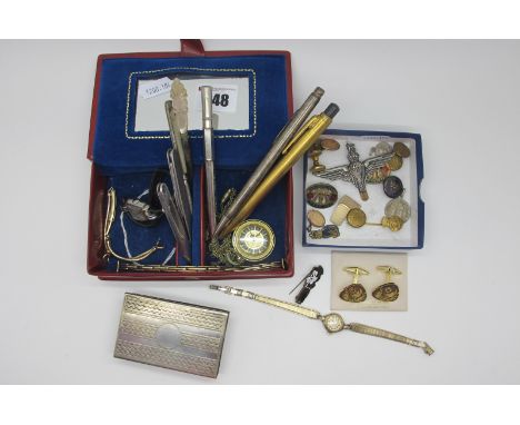 Cufflinks, enamel and other badges, vintage ladies wristwatches, EPNS engine turned match box cover, penknives, mother of pea