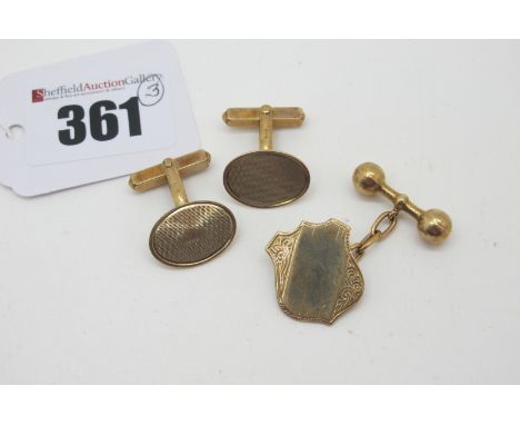 A Pair of 9ct Gold Cufflinks, the engine turned oval panels on swivel bar backs (4.7grams); Together with A Single Cufflink, 