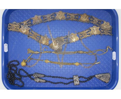 An Art Nouveau Ladies Belt, stamped "Rd No 401461", 71cm long (link damage); together with an Egyptian Revival long black gla