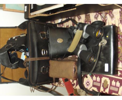 Two pairs of field glasses together with camera and cine equipment
