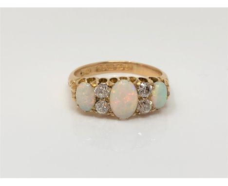 A fine antique 18ct gold opal and diamond ring, size L