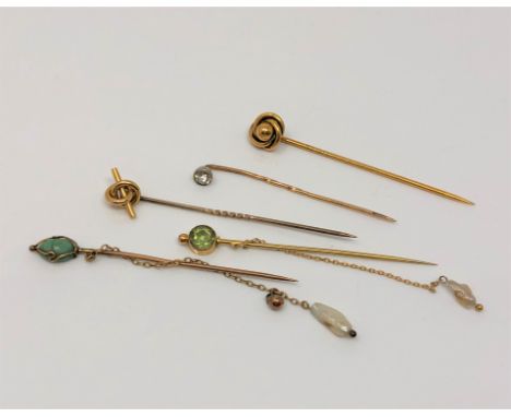 A group of five antique gold stick pins including two with pearl drops  CONDITION REPORT: 5.9g gross