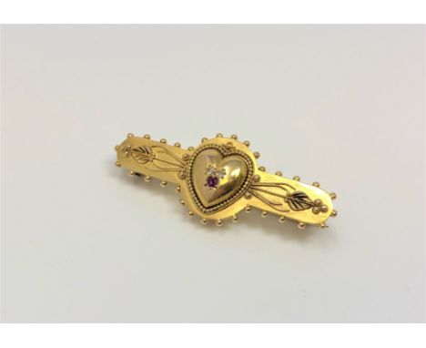 A 15ct gold brooch with central heart set with ruby and diamond CONDITION REPORT: 4.0g Very small knock in the back which is 