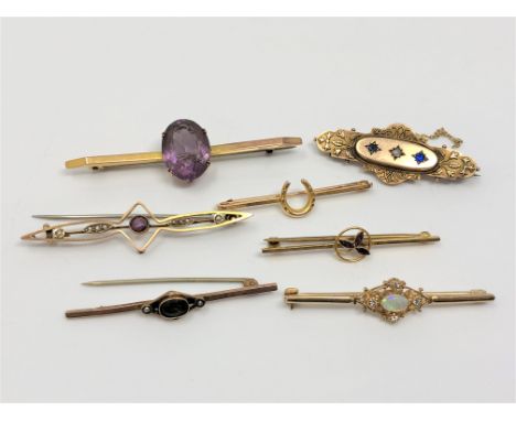 A group of seven gold brooches set with opal, amethyst, seed pearls, tourmaline etc CONDITION REPORT: 16.8g gross