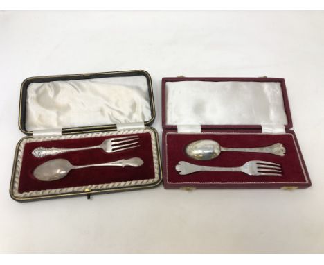 Two boxed silver fork and spoon sets