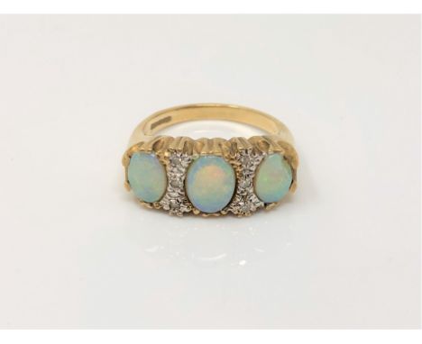 A 9ct gold opal and diamond ring (one opal chipped), size N CONDITION REPORT: 4.4g