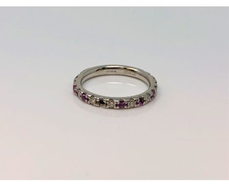 A platinum ruby and diamond half eternity ring, size I (two rubies missing) CONDITION REPORT: 3.5g