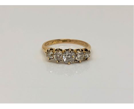 A fine Victorian 18ct gold ring dated 1888 to shank, set with five old cut diamonds, total diamond weight estimated at 1.0 ca