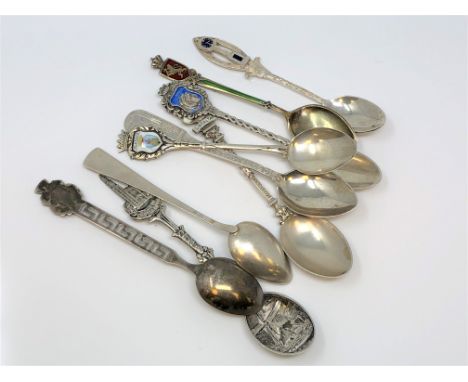 Nine assorted silver and enamel spoons. (9)