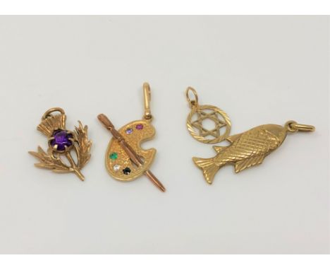 Four gold charms including an artist's palette set with emerald, amethyst, ruby and sapphire (4) CONDITION REPORT: 5g