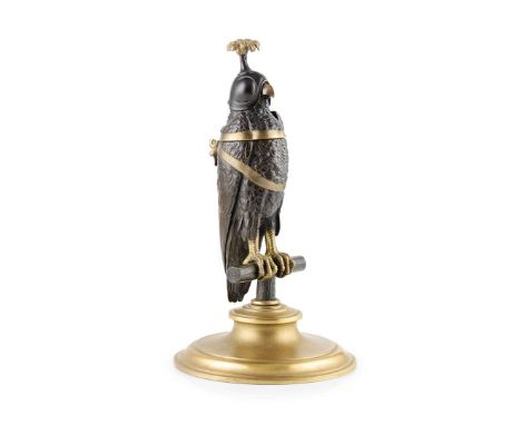  CONTINENTAL GILT AND PATINATED BRONZE FALCON INKWELL LATE 19TH CENTURY in the form of a hooded hawk on its perch, the wings 