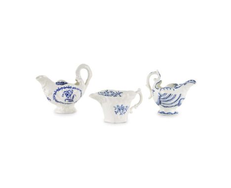  THREE ENGLISH PORCELAIN UNDERGLAZE BLUE CREAM EWERS LATE 18TH CENTURY comprising a Derby dolphin ewer with stylised line and