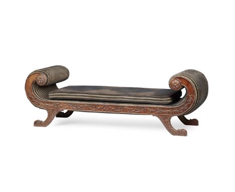  REGENCY MAHOGANY 'GRECIAN' DAYBED EARLY 19TH CENTURY with scroll ends and a loose cushion seat, the frame carved on all side