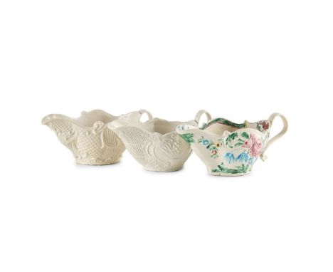  TWO STAFFORDSHIRE WHITE SALTGLAZE SAUCE BOATS CIRCA 1760 one with basket, diamond and scroll moulding, possibly modelled by 