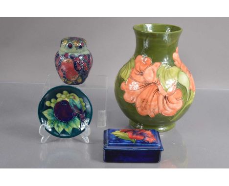 Four good examples of Moorcroft Pottery, condisting of a lidded trinket box, a jar and cover, a small dish and a vase. The bo
